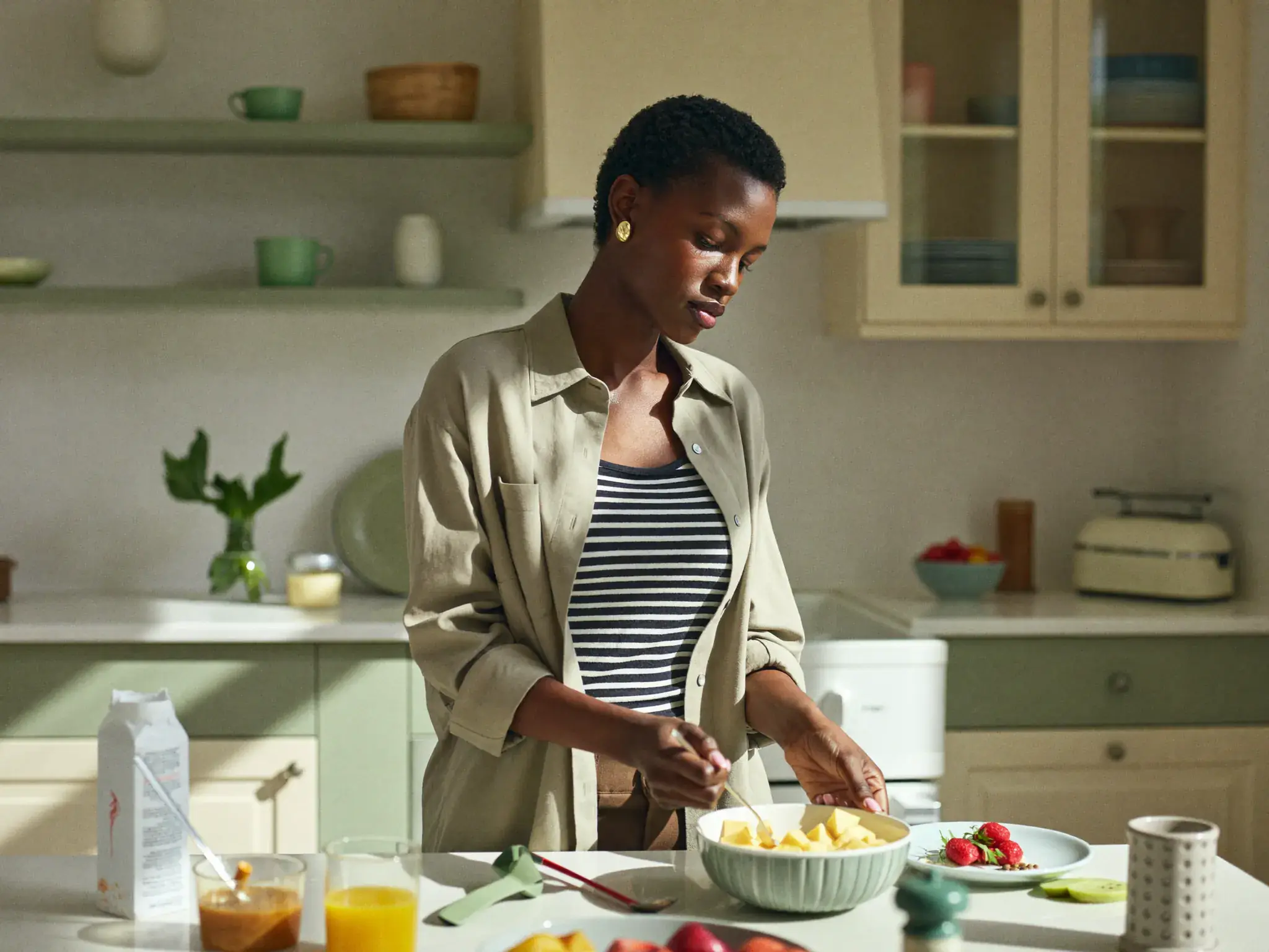 Adult preparing a healthy breakfast at home as part of a daily wellness routine